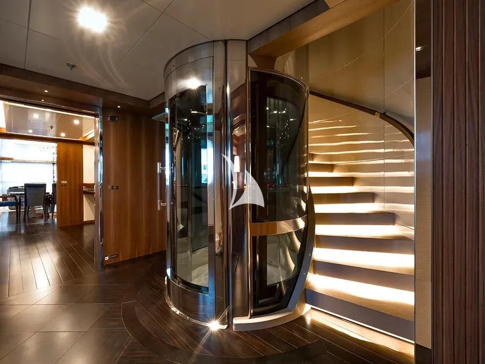 a large room with glass walls aboard TALEYA Yacht for Sale