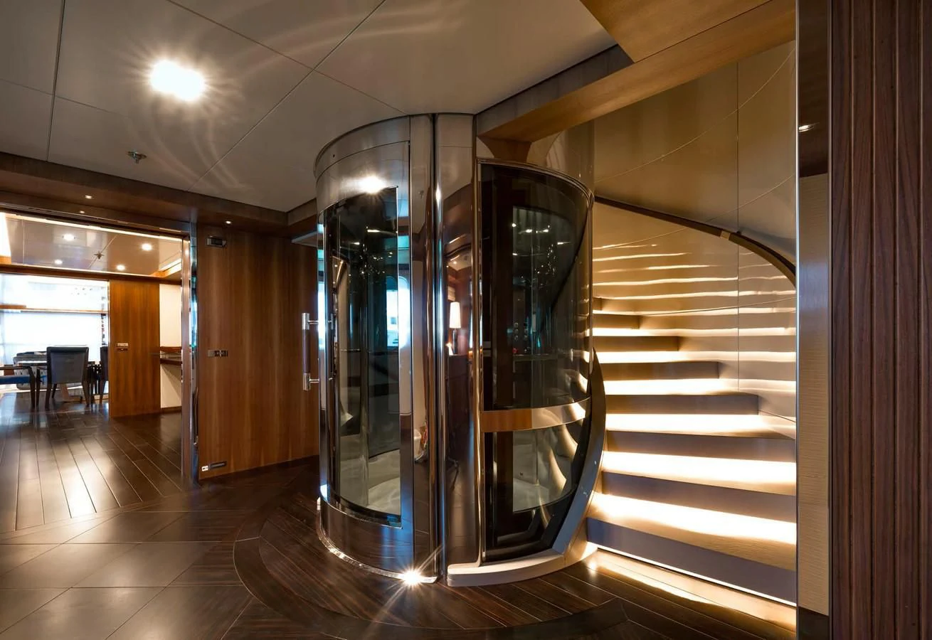 a large room with glass doors aboard TALEYA Yacht for Sale