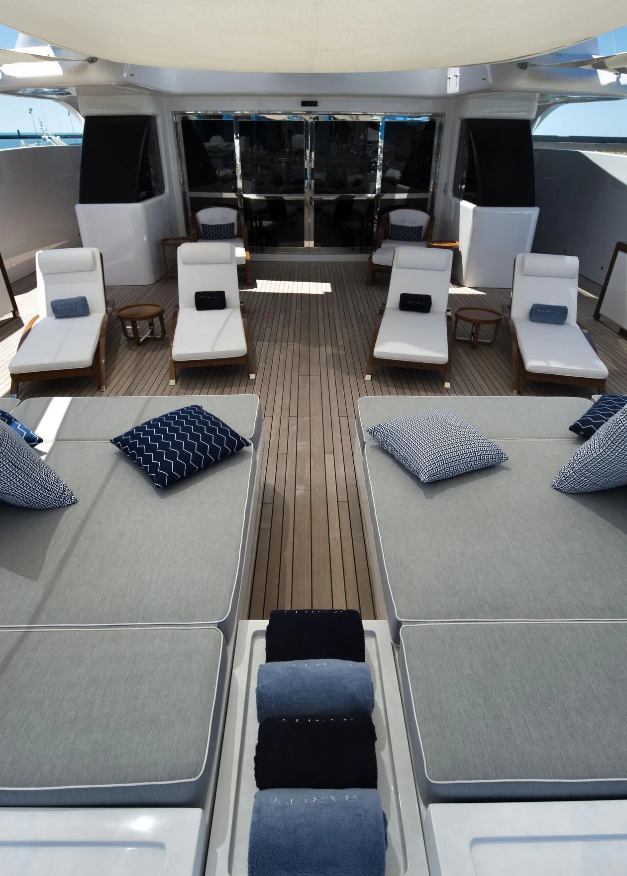 a room with a bed and a table aboard TALEYA Yacht for Sale