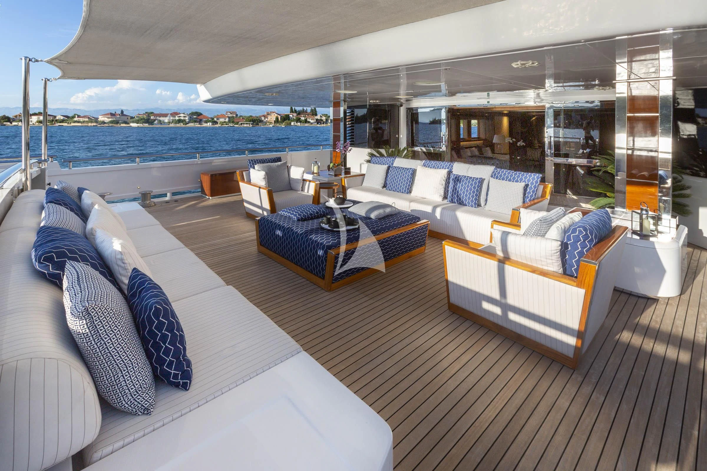 a large room with couches and a pool aboard TALEYA Yacht for Sale