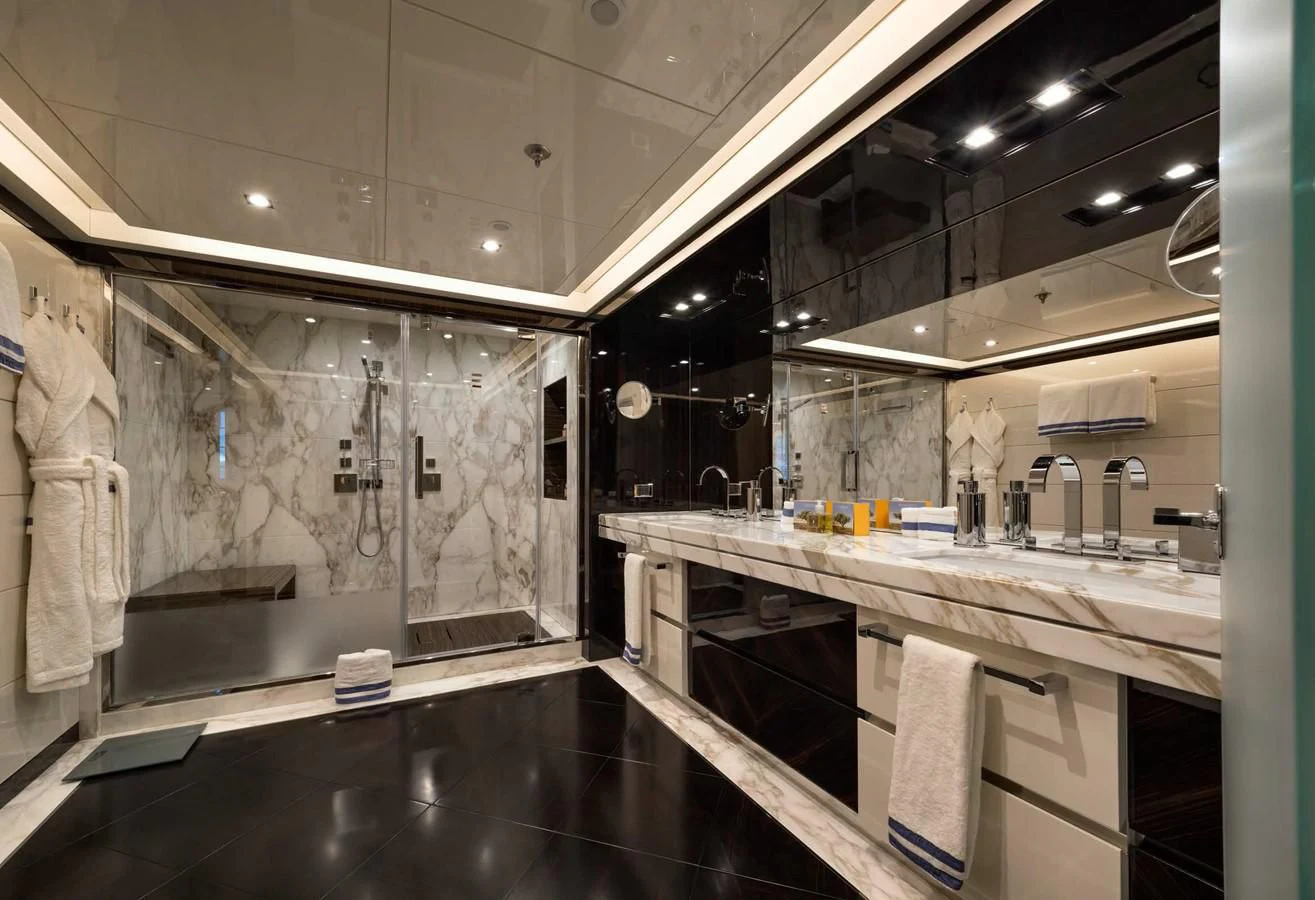 a bathroom with a large mirror aboard TALEYA Yacht for Sale
