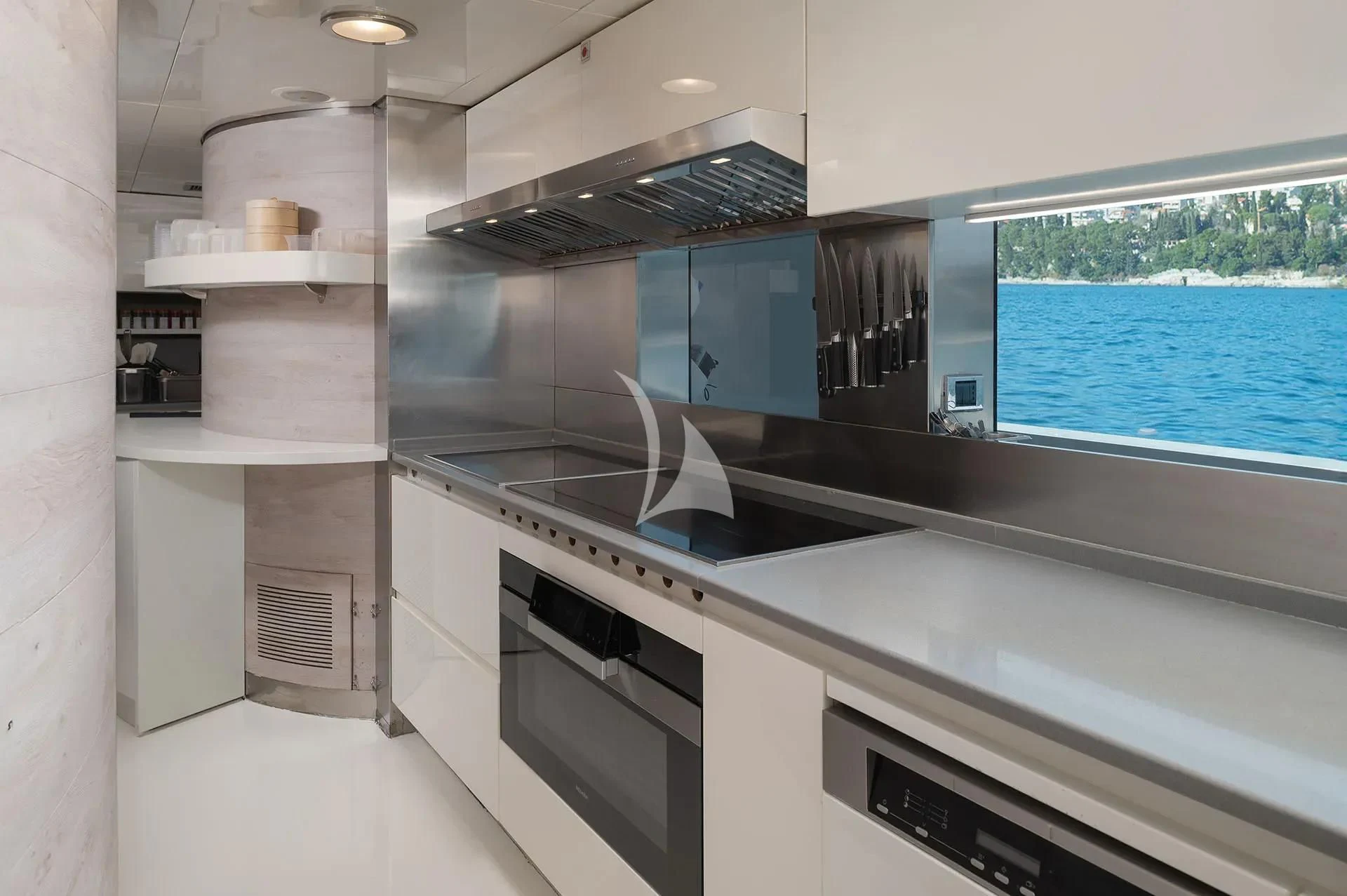 a kitchen with a large island aboard TALEYA Yacht for Sale