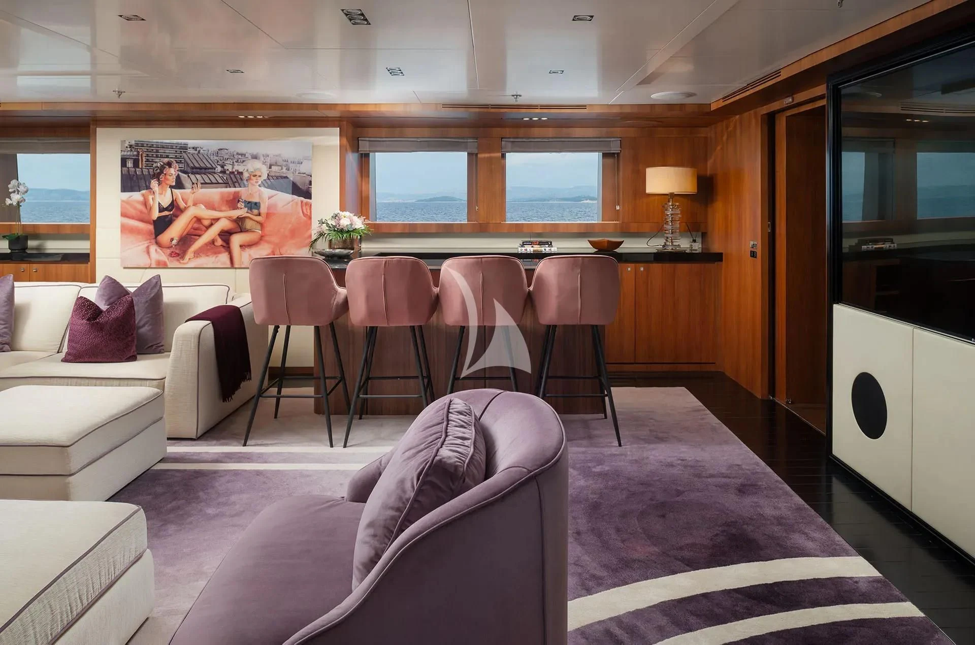 a room with a couch and a table and chairs aboard TALEYA Yacht for Sale