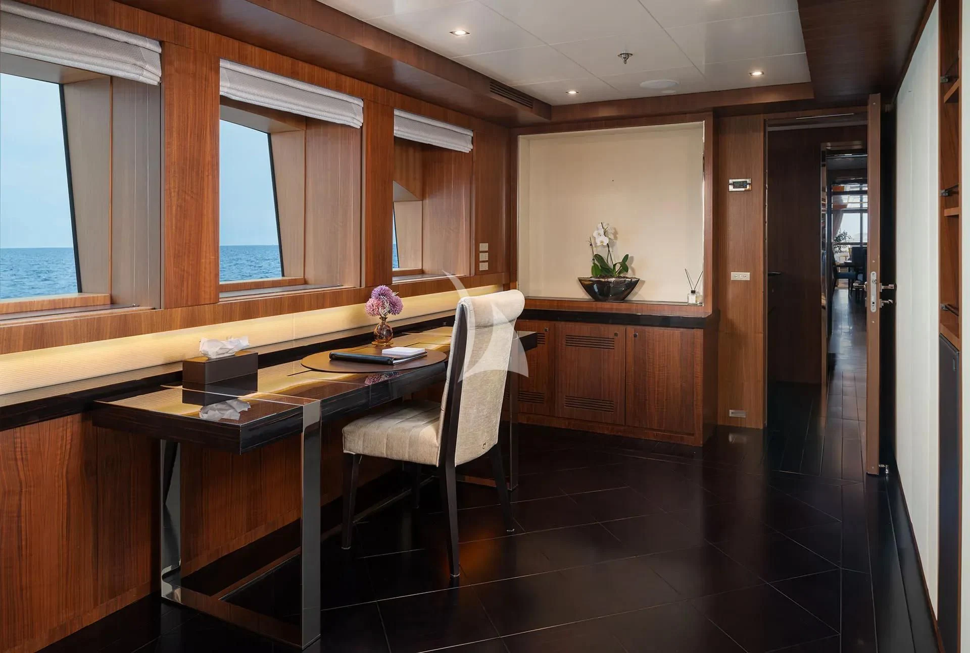 a room with a table and chairs aboard TALEYA Yacht for Sale