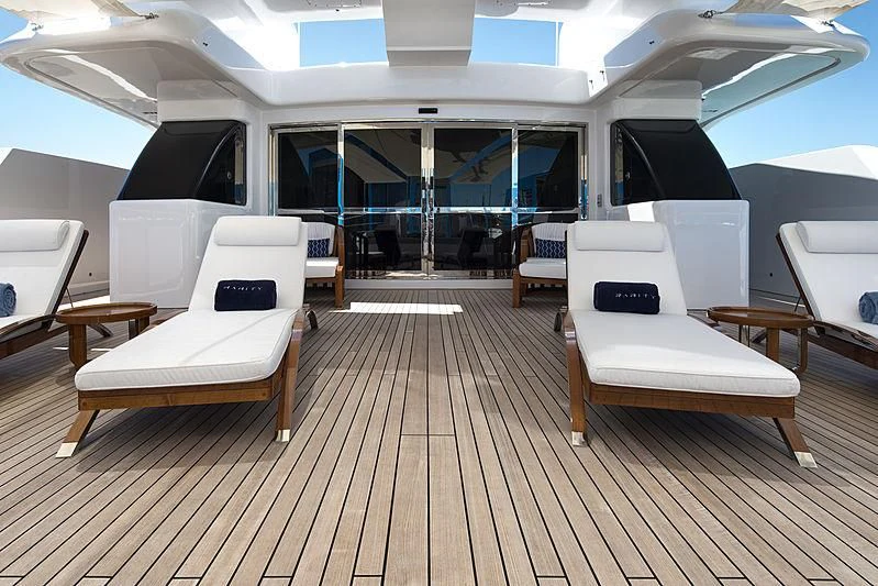 a room with a wood floor and a large window with a wood floor aboard TALEYA Yacht for Sale