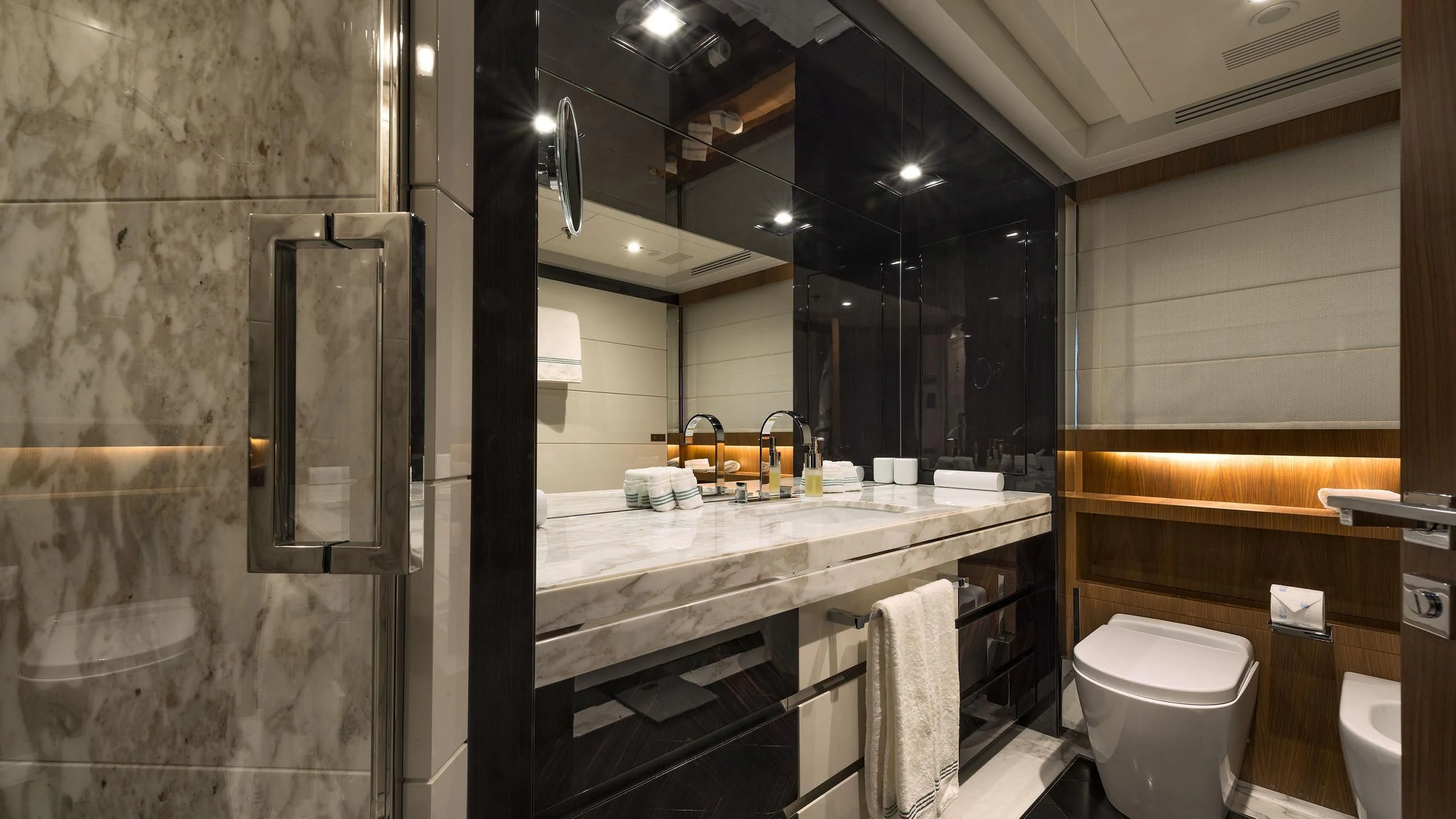 a bathroom with a sink and toilet aboard TALEYA Yacht for Sale