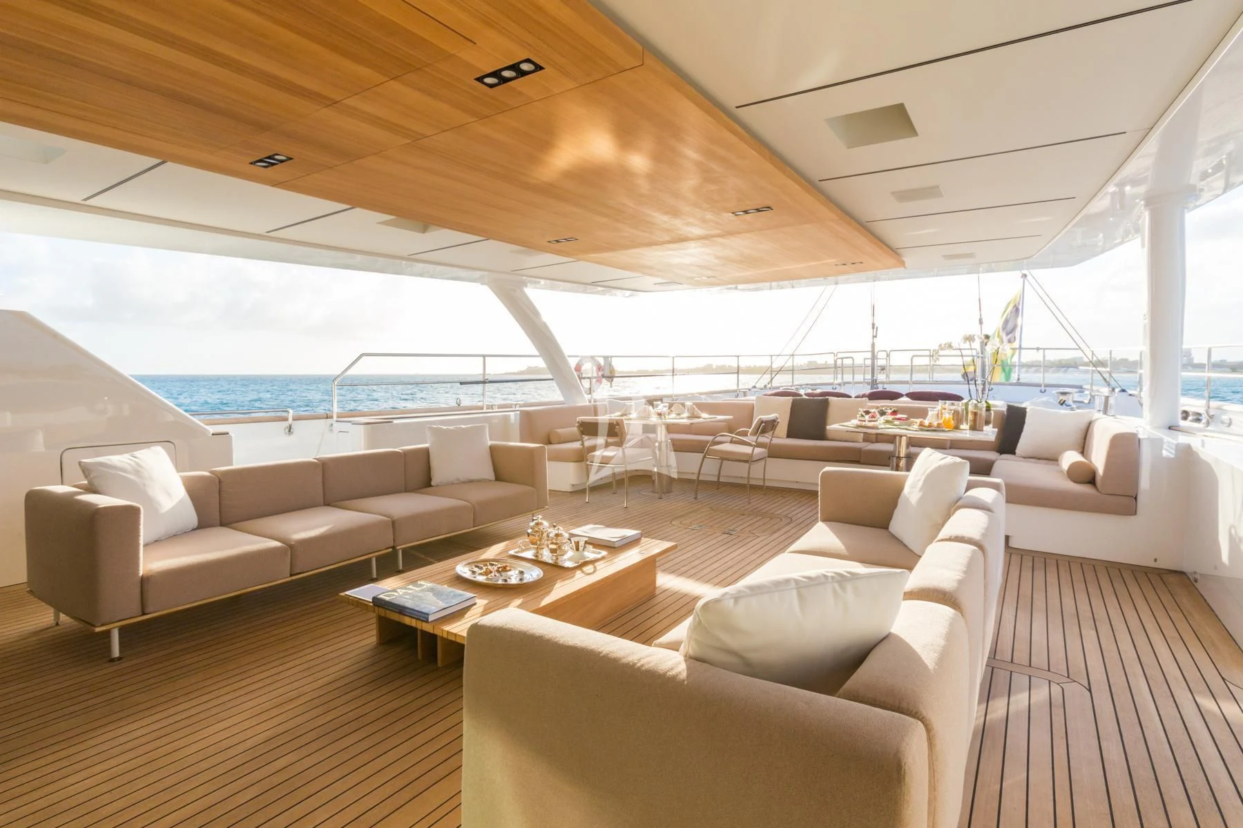 a living room with a large window aboard SPIRIT OF THE C'S Yacht for Charter