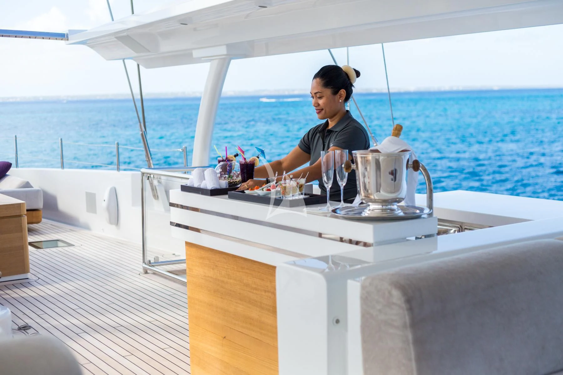 a person sitting at a table aboard SPIRIT OF THE C'S Yacht for Charter
