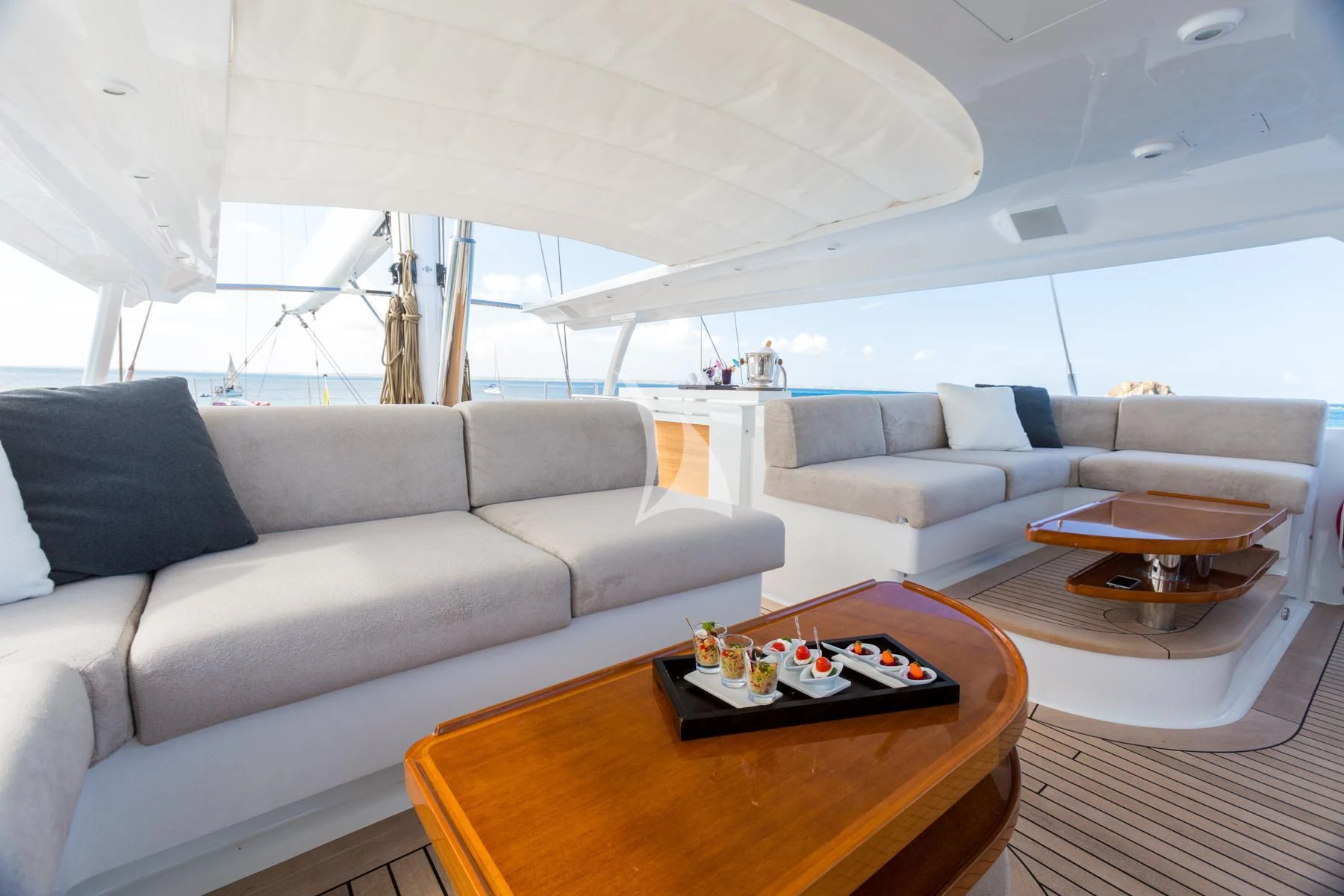 a living room with a couch and a coffee table aboard SPIRIT OF THE C'S Yacht for Charter