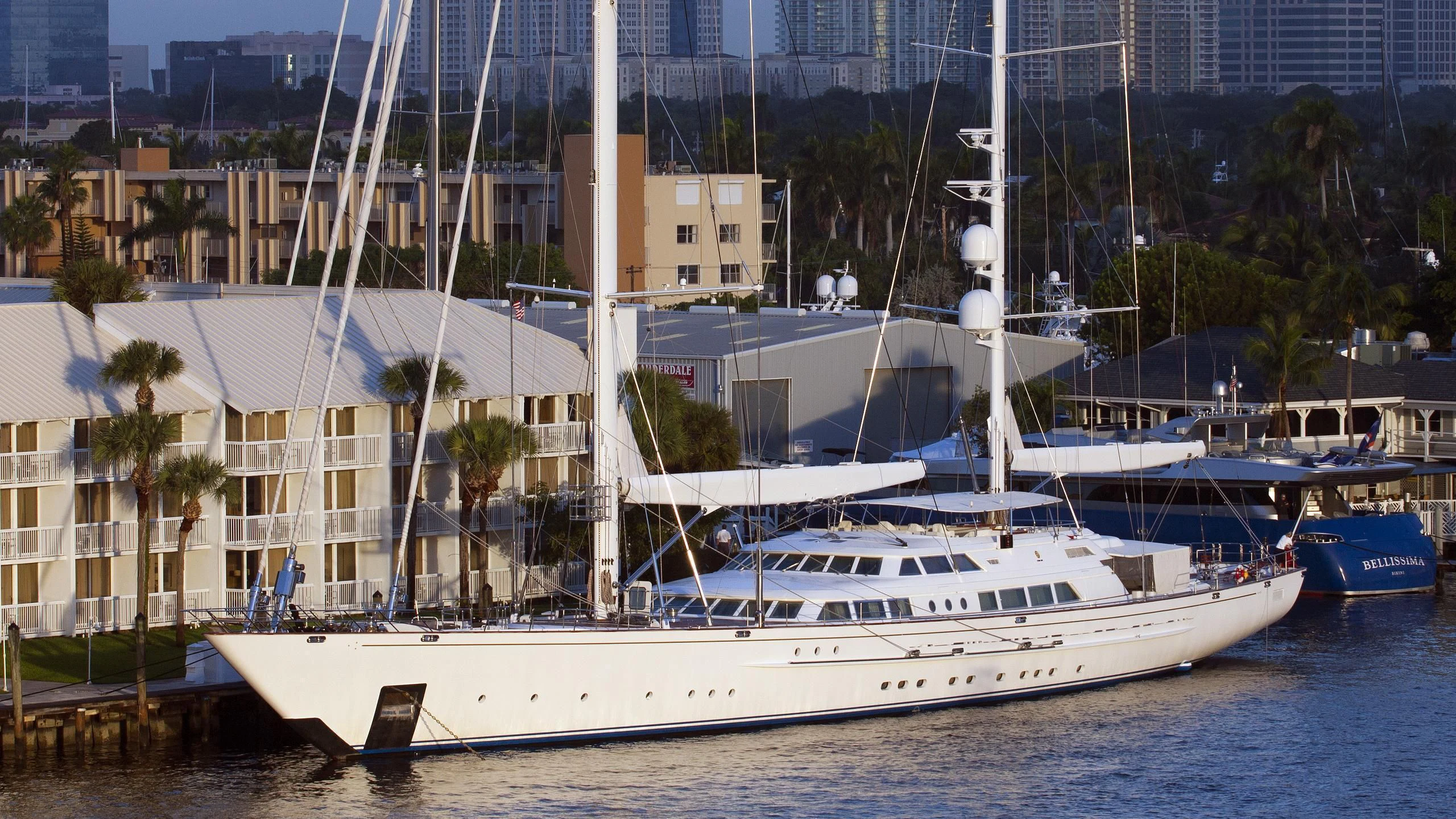 a white boat in a harbor aboard SPIRIT OF THE C'S Yacht for Charter