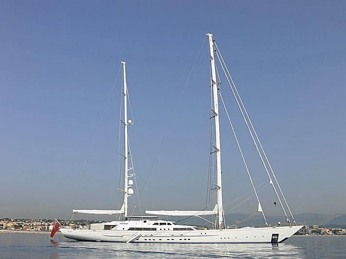 a white boat on a beach aboard SPIRIT OF THE C'S Yacht for Charter
