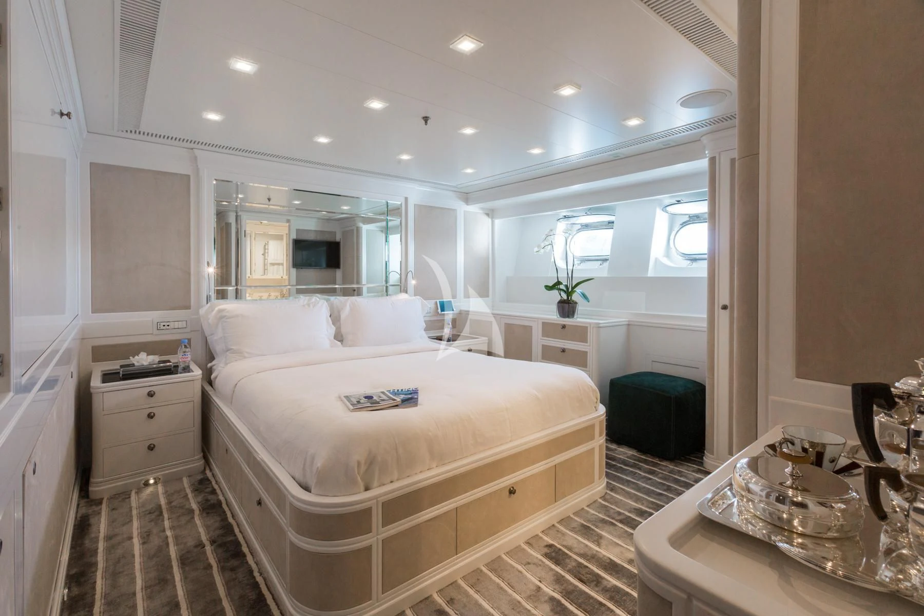 a large white bed in a room aboard SPIRIT OF THE C'S Yacht for Charter