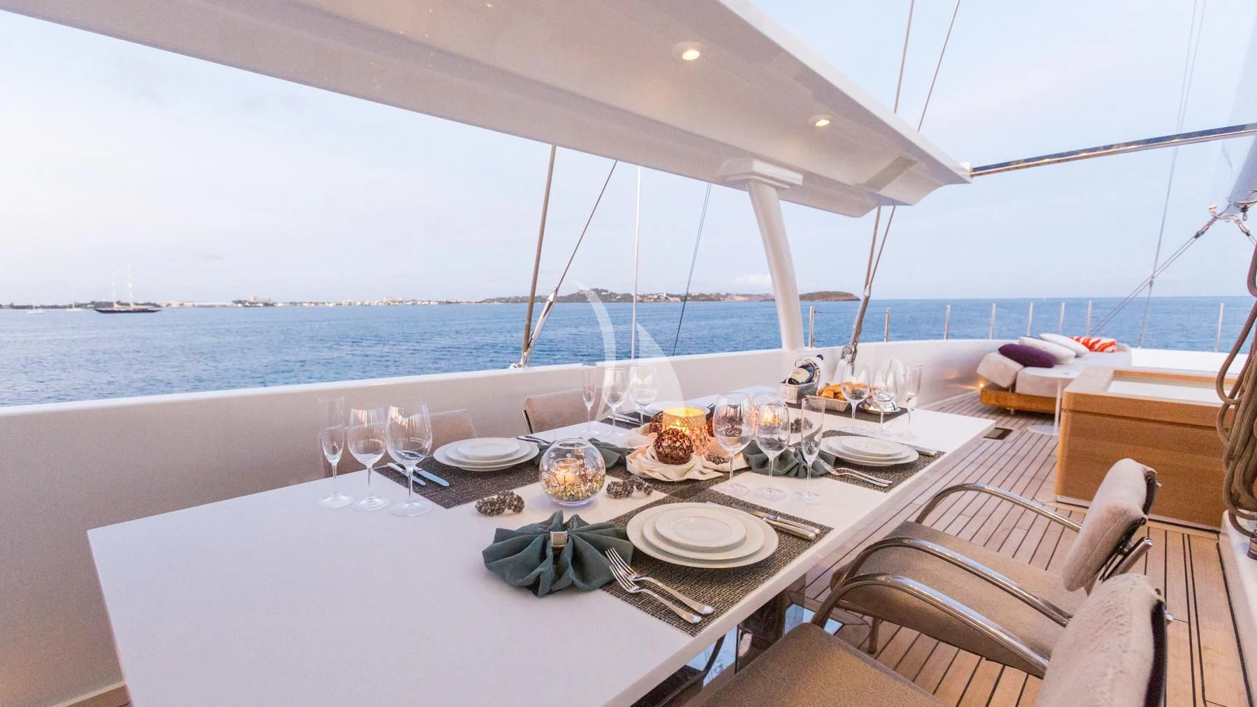 a table set for a dinner aboard SPIRIT OF THE C'S Yacht for Charter