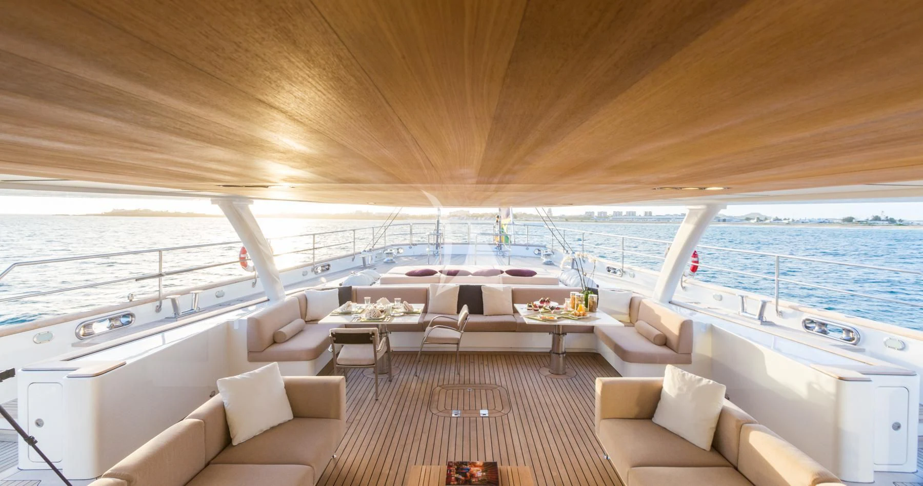 a room with a couch and a table and chairs aboard SPIRIT OF THE C'S Yacht for Charter