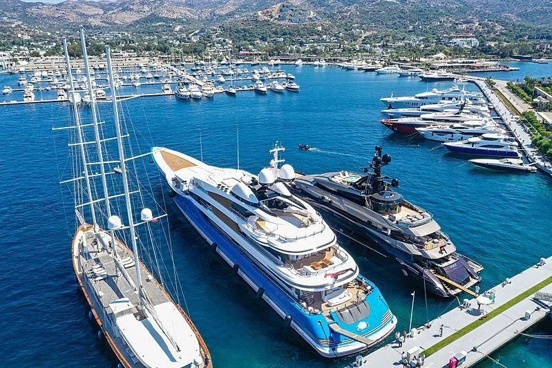 a large ship docked at a port aboard MADAME GU Yacht for Sale