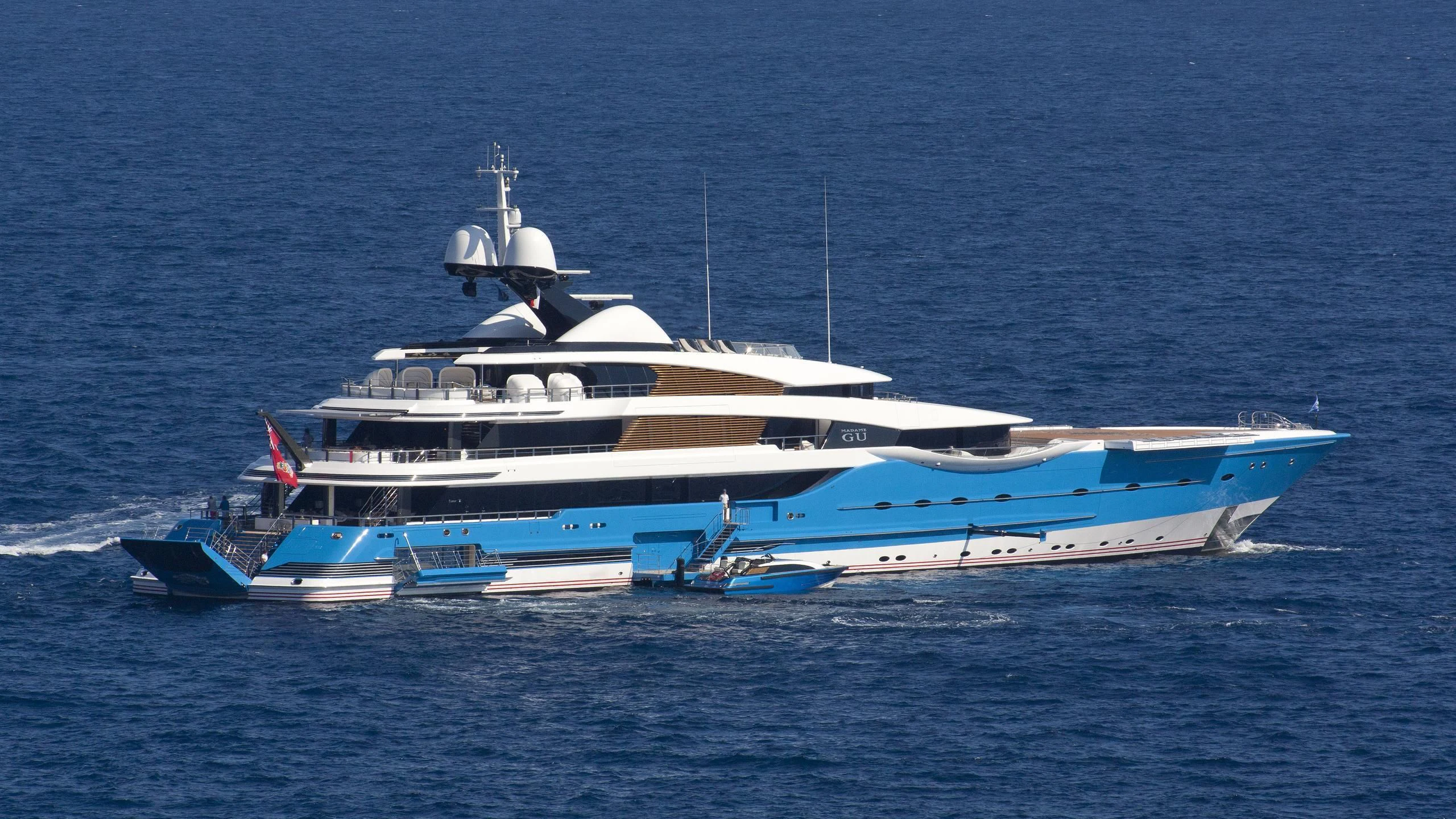 a large white boat in the water aboard MADAME GU Yacht for Sale