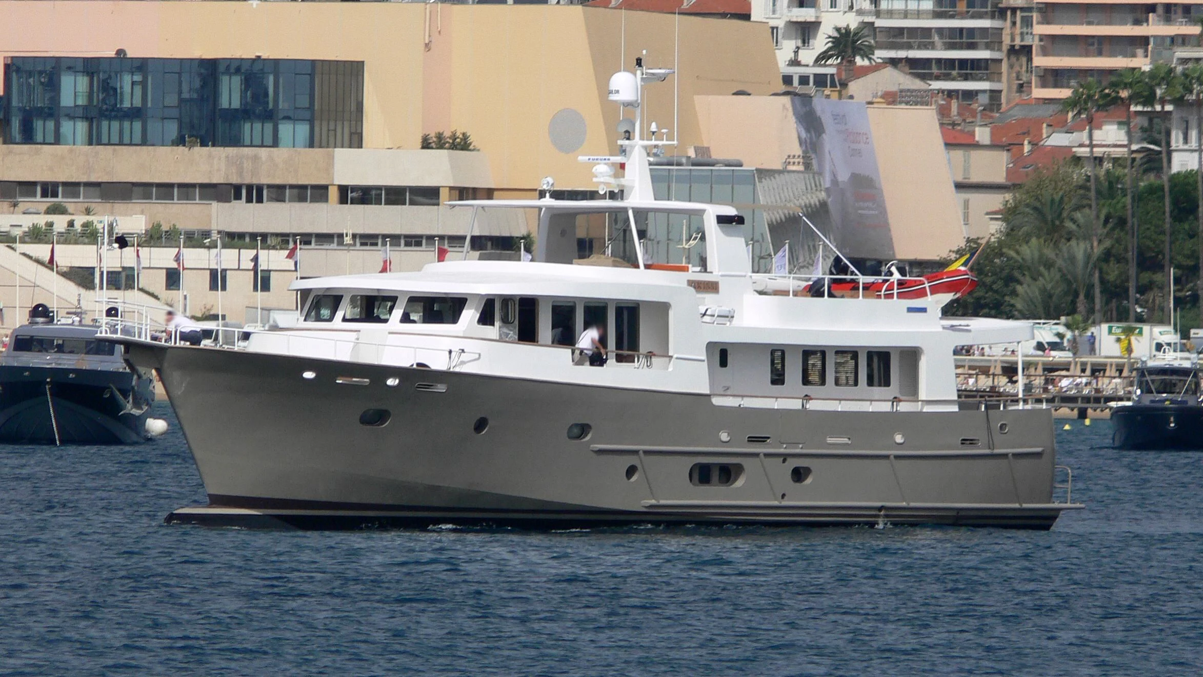 a large white boat in the water aboard AKISSI Yacht for Sale