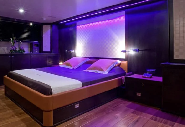 a bed in a room aboard AKISSI Yacht for Sale
