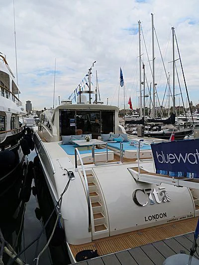 a boat with a flag on the deck aboard CITA Yacht for Sale