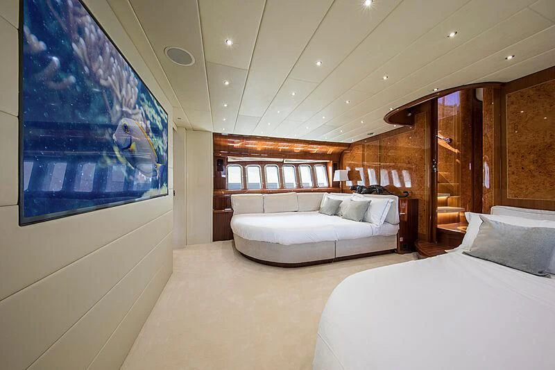 a room with a bed and a couch aboard CITA Yacht for Sale