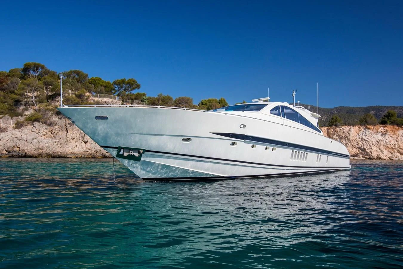 a white boat in the water aboard CITA Yacht for Sale