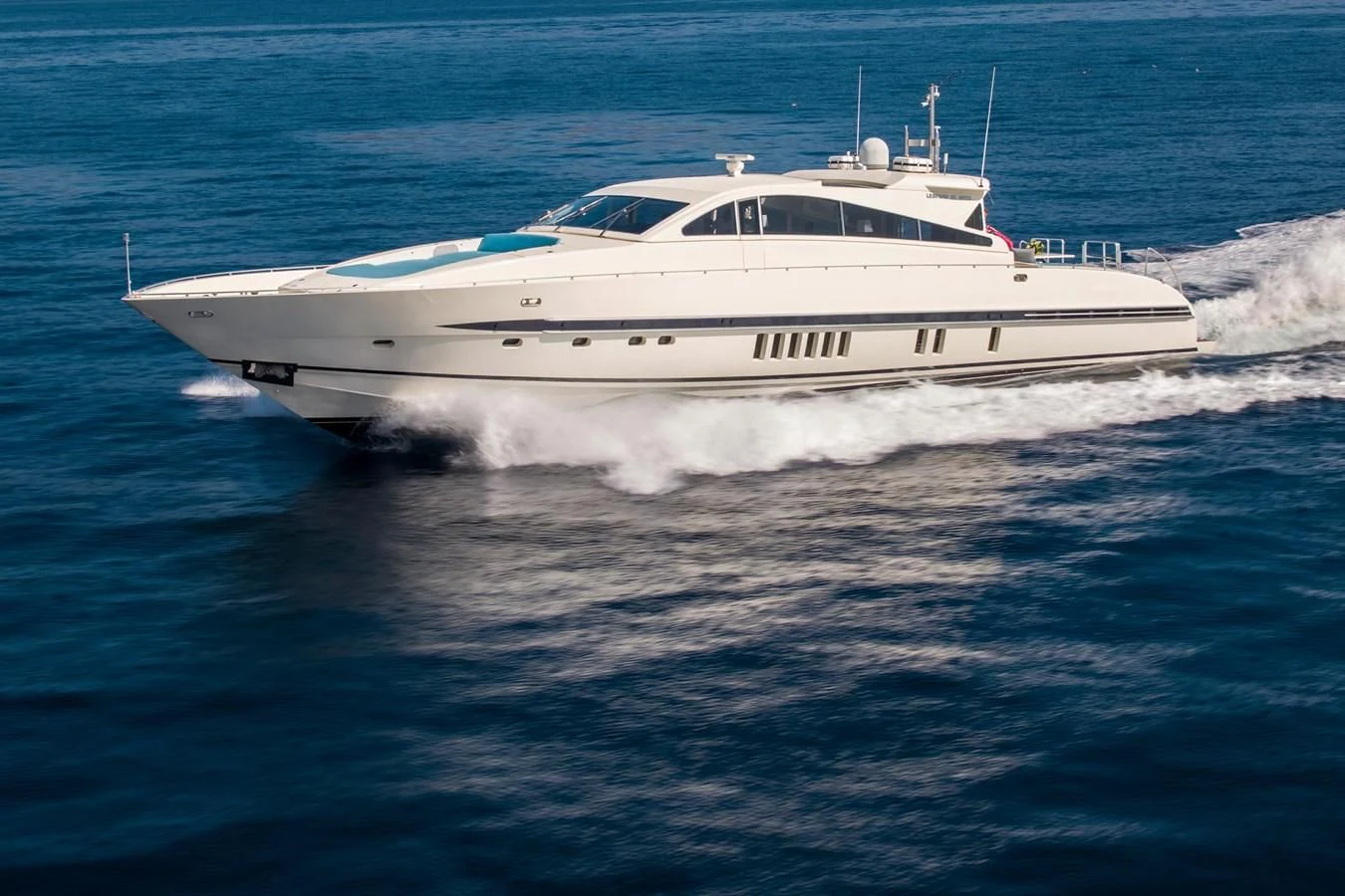 a white yacht on the water aboard CITA Yacht for Sale