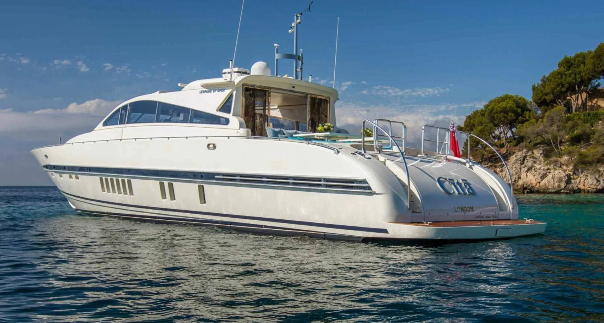 a white boat in the water aboard CITA Yacht for Sale