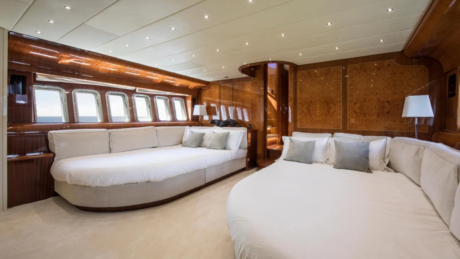 a room with a bed and a couch aboard CITA Yacht for Sale