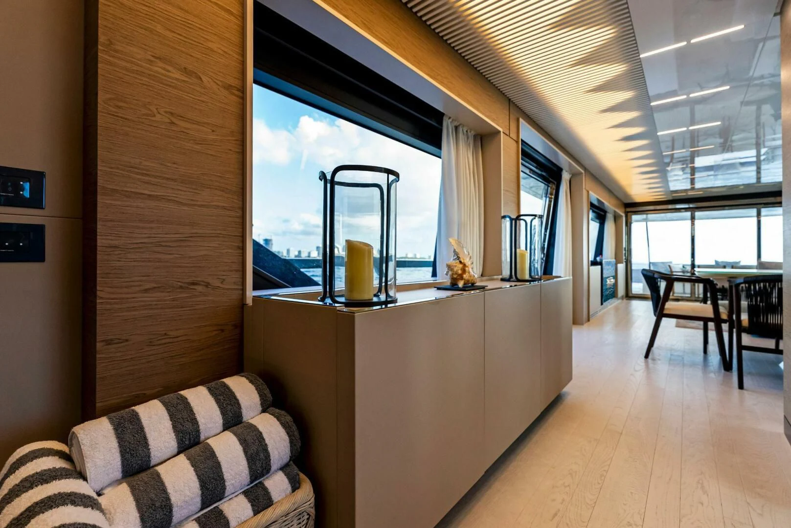 a room with a large window and a wood floor aboard SILHOUETTE Yacht for Sale