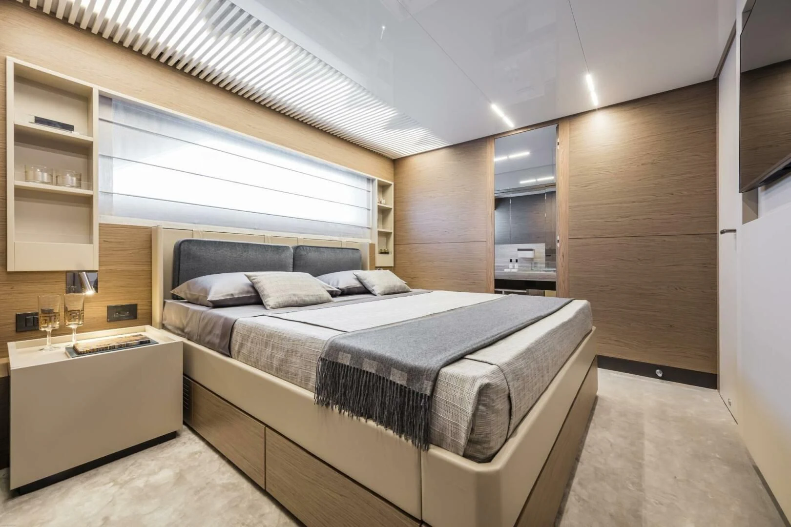 a bedroom with a bed and a desk aboard SILHOUETTE Yacht for Sale