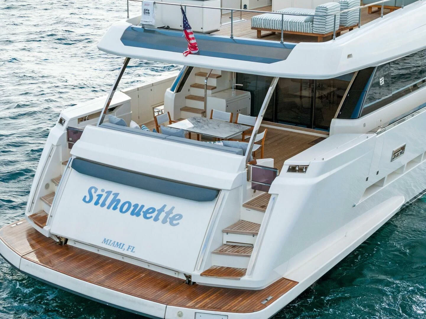 a white boat on the water aboard SILHOUETTE Yacht for Sale