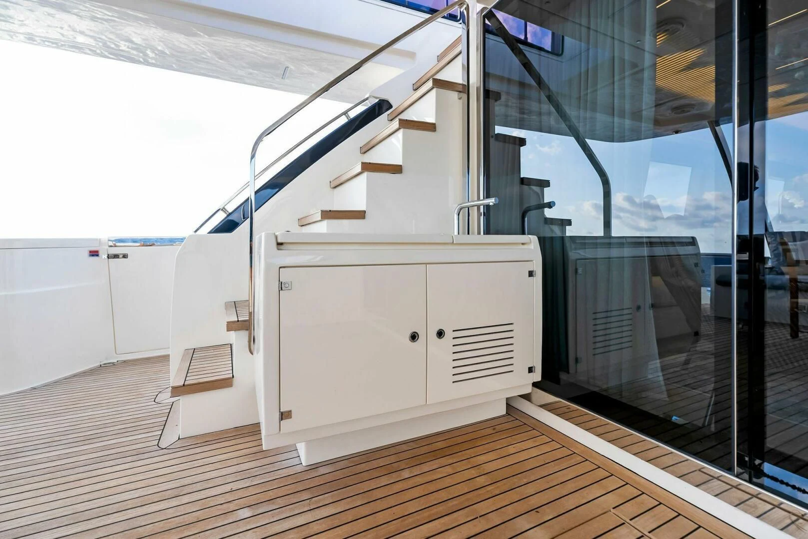 a white room with a staircase aboard SILHOUETTE Yacht for Sale