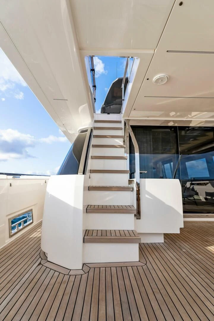 a staircase with a glass door aboard SILHOUETTE Yacht for Sale