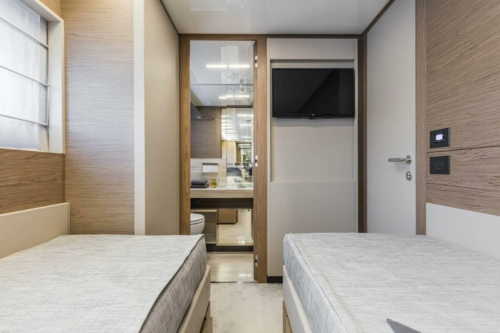 a room with a bed and a table aboard SILHOUETTE Yacht for Sale