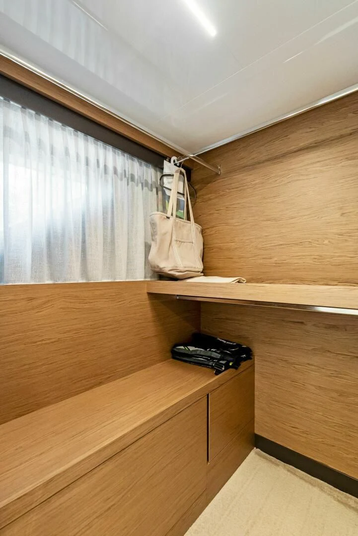 a wood shelf with a bag on it aboard SILHOUETTE Yacht for Sale