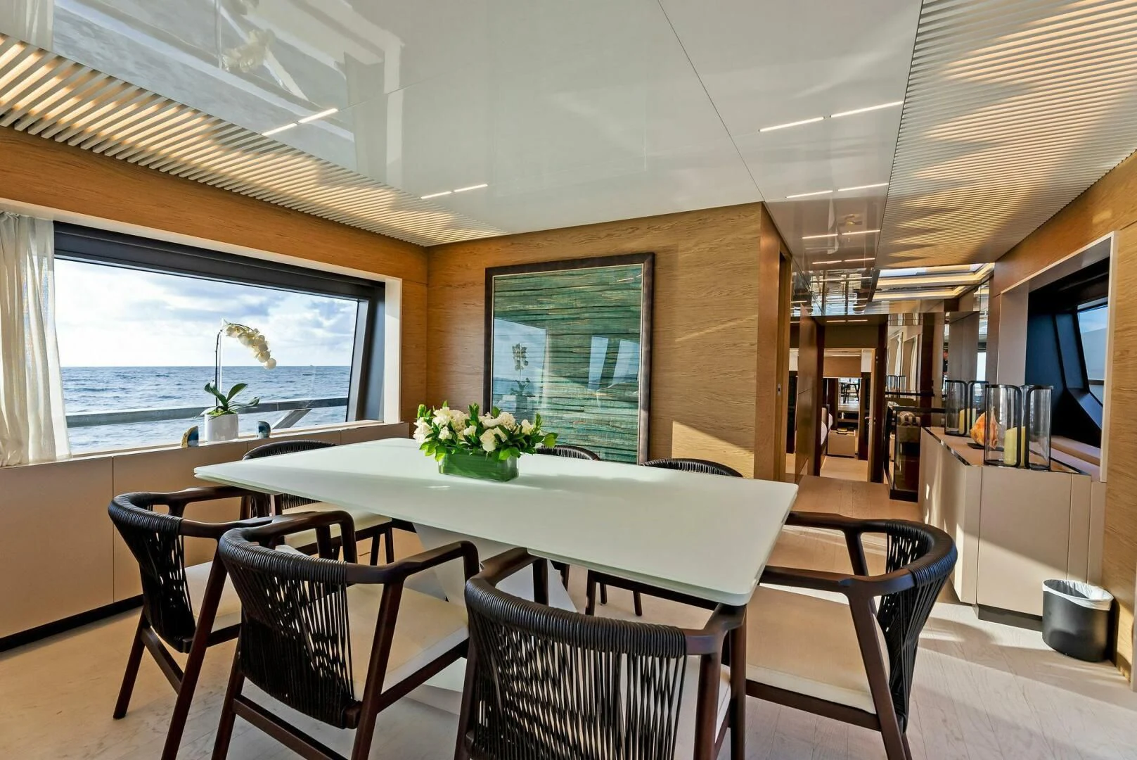a room with a table and chairs aboard SILHOUETTE Yacht for Sale