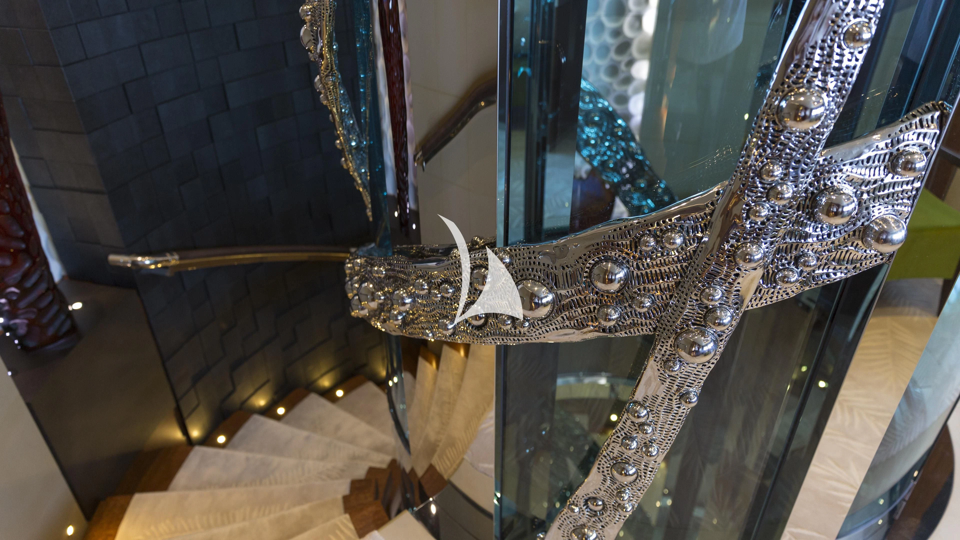 a gold and silver statue aboard NIRVANA Yacht for Sale