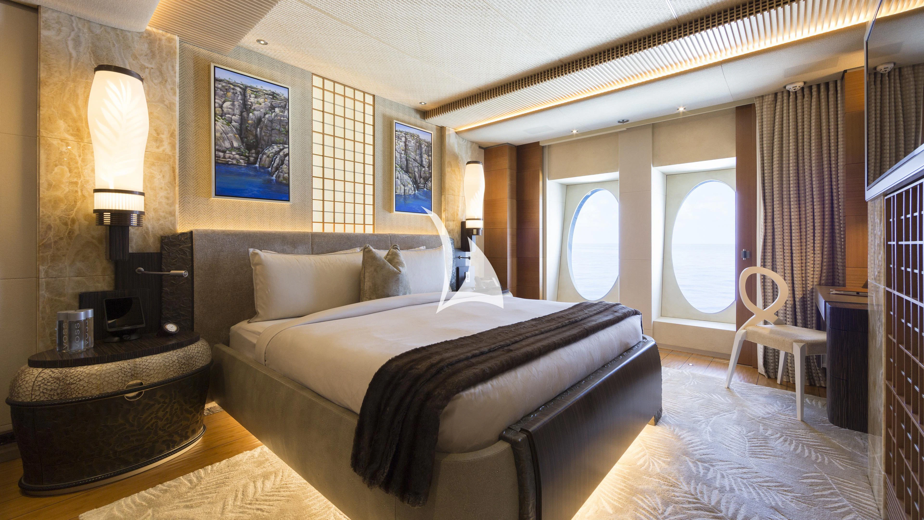 a large bed in a room aboard NIRVANA Yacht for Sale