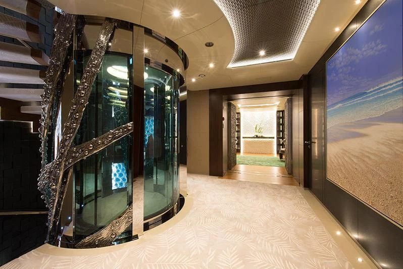 a large room with a large staircase aboard NIRVANA Yacht for Sale