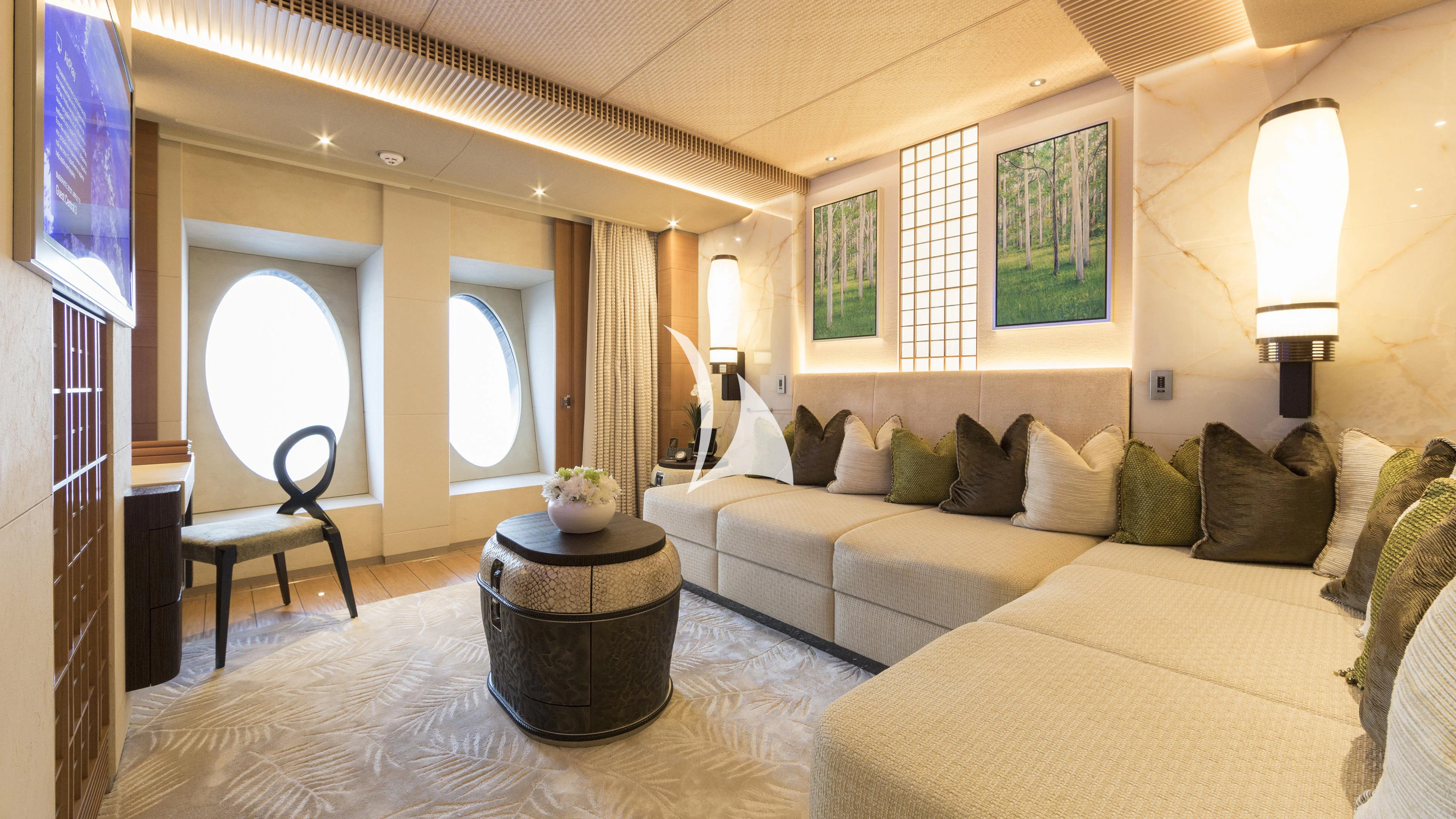 a room with a bed and a table aboard NIRVANA Yacht for Sale