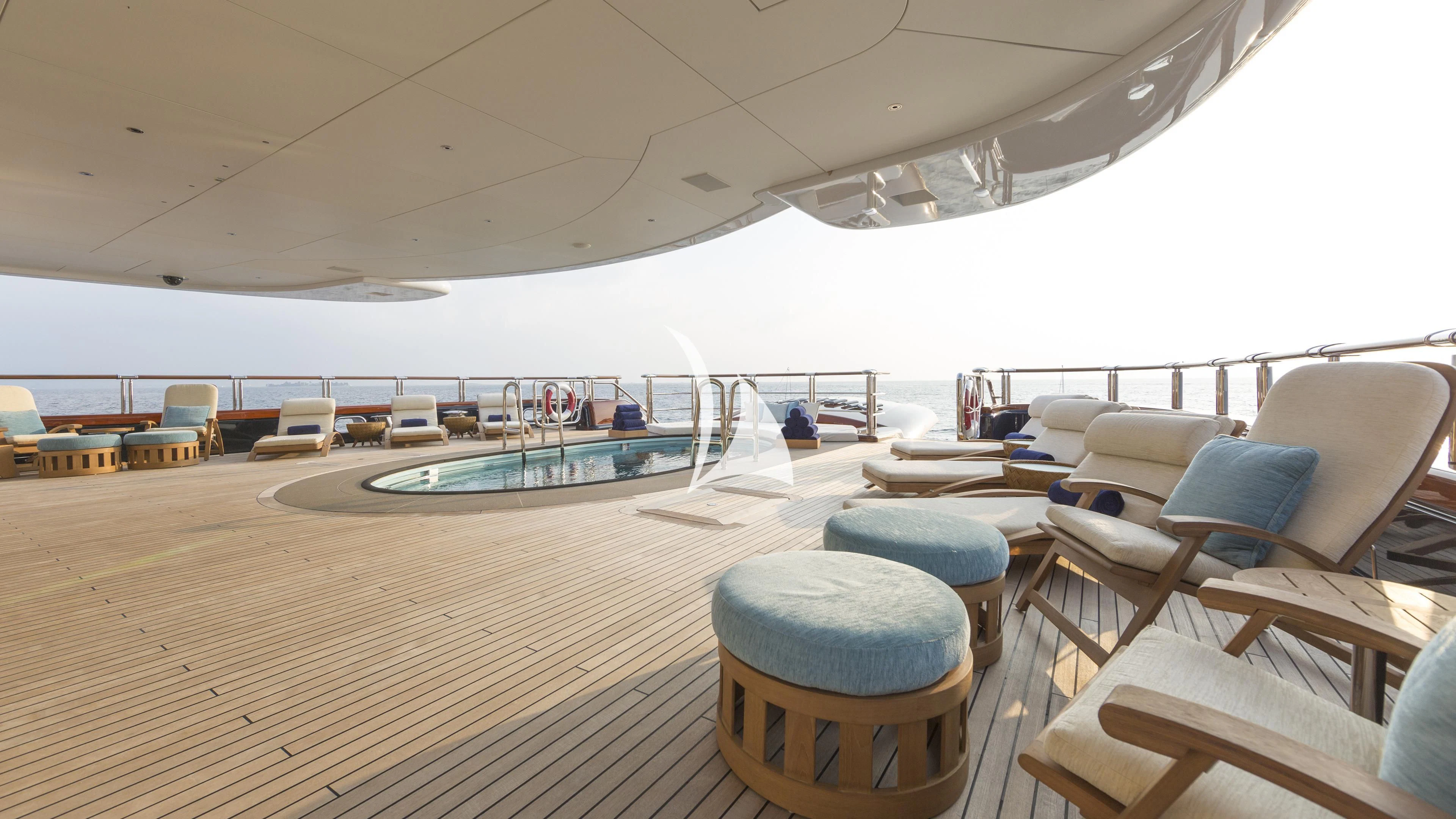 a large lounge area with a pool aboard NIRVANA Yacht for Sale