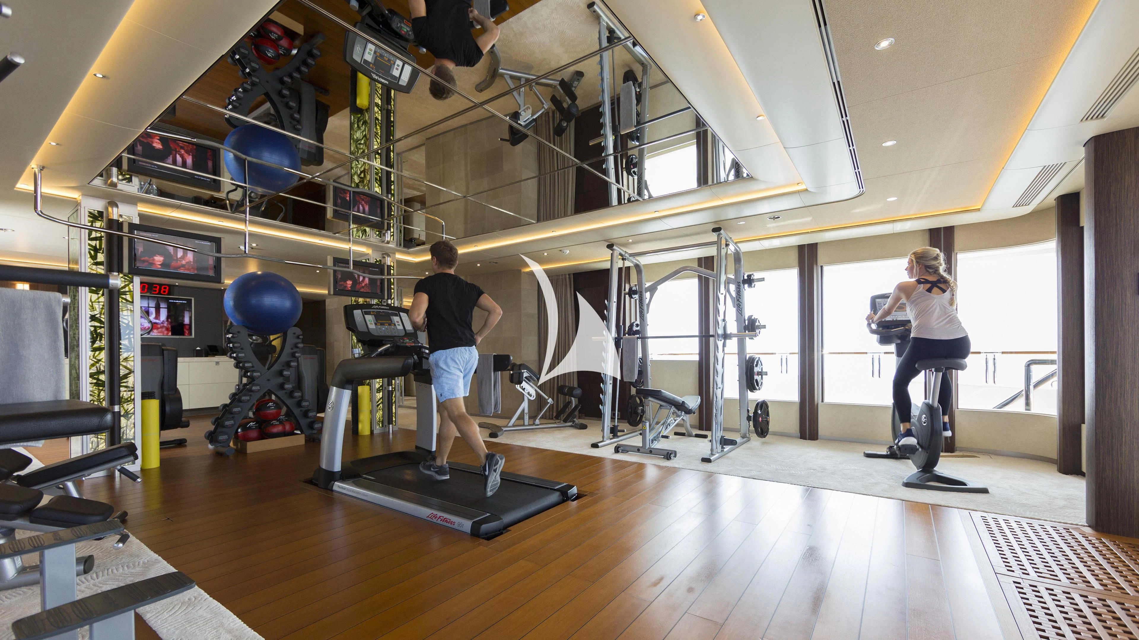 a group of people in a gym aboard NIRVANA Yacht for Sale