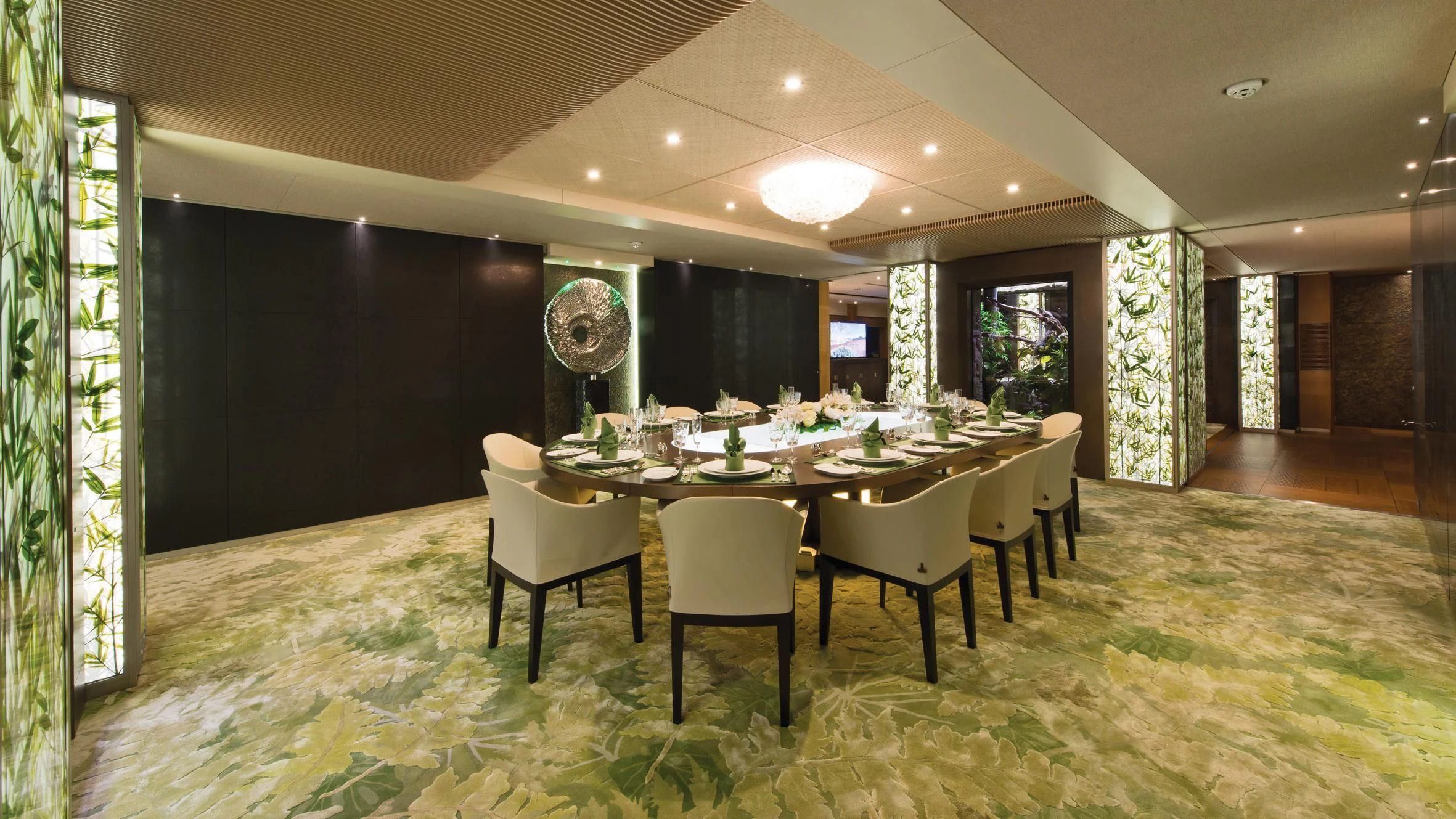 a large room with a table and chairs aboard NIRVANA Yacht for Sale