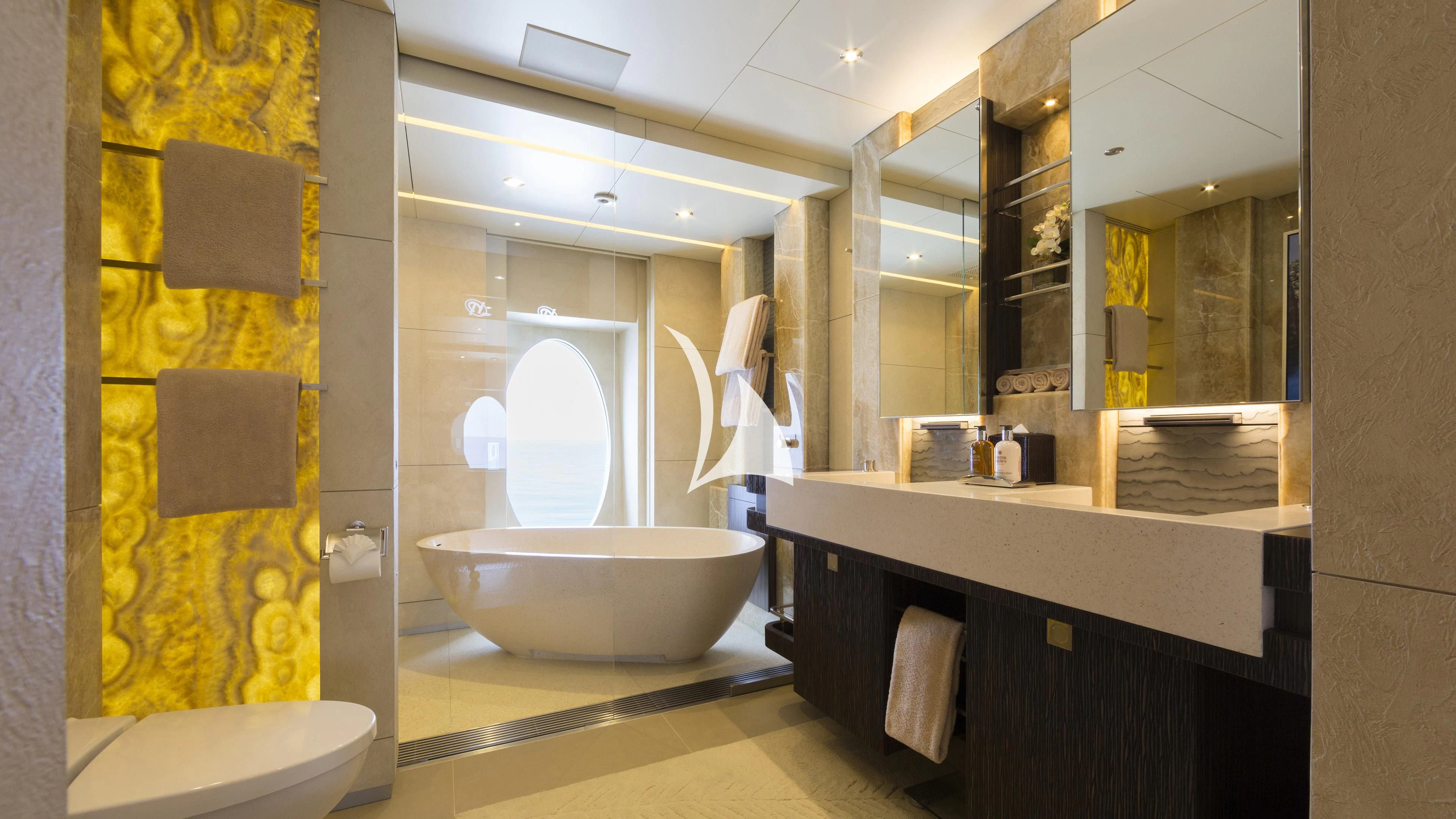 a bathroom with a tub sink and toilet aboard NIRVANA Yacht for Sale