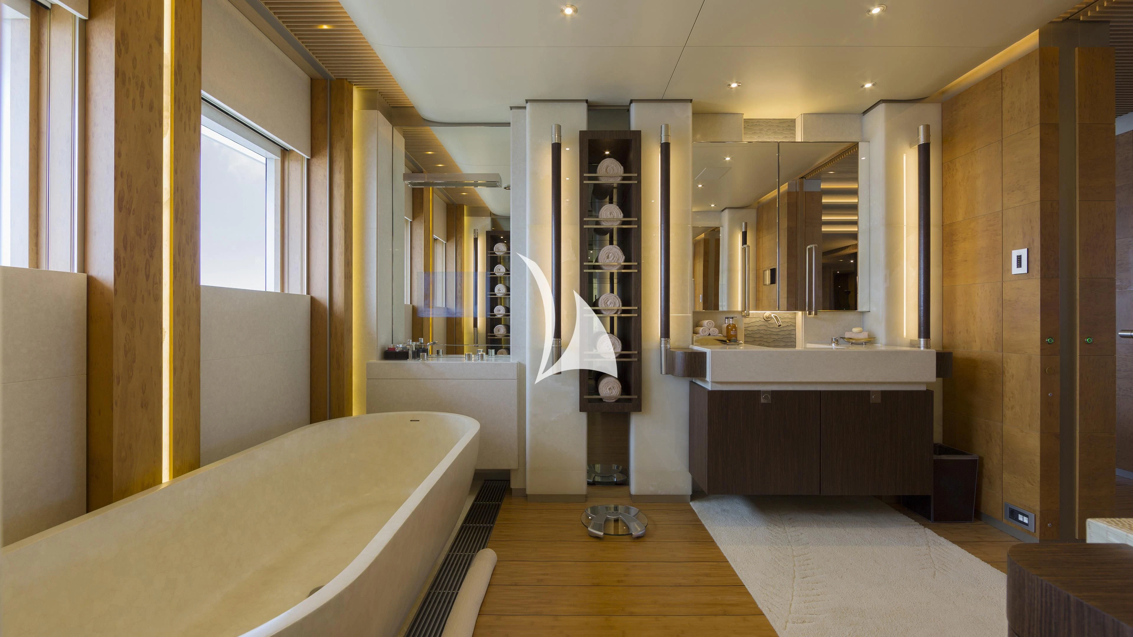 a room with a bed and a desk aboard NIRVANA Yacht for Sale