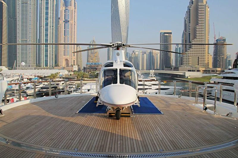 a white helicopter on a platform aboard NIRVANA Yacht for Sale