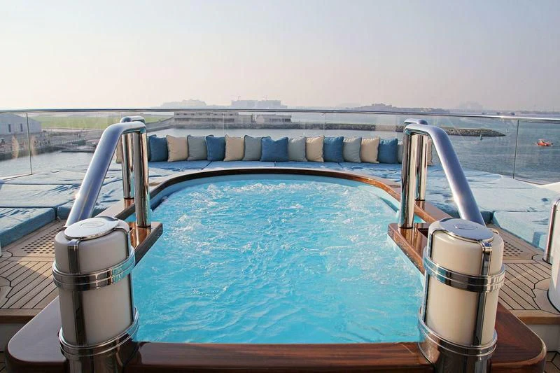 a boat with a drink and a cup on the front aboard NIRVANA Yacht for Sale