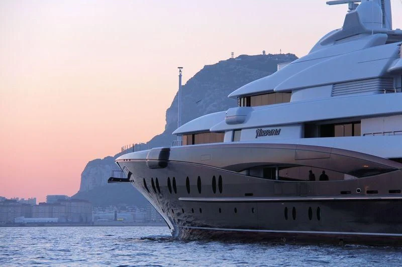 a large white boat on the water aboard NIRVANA Yacht for Sale