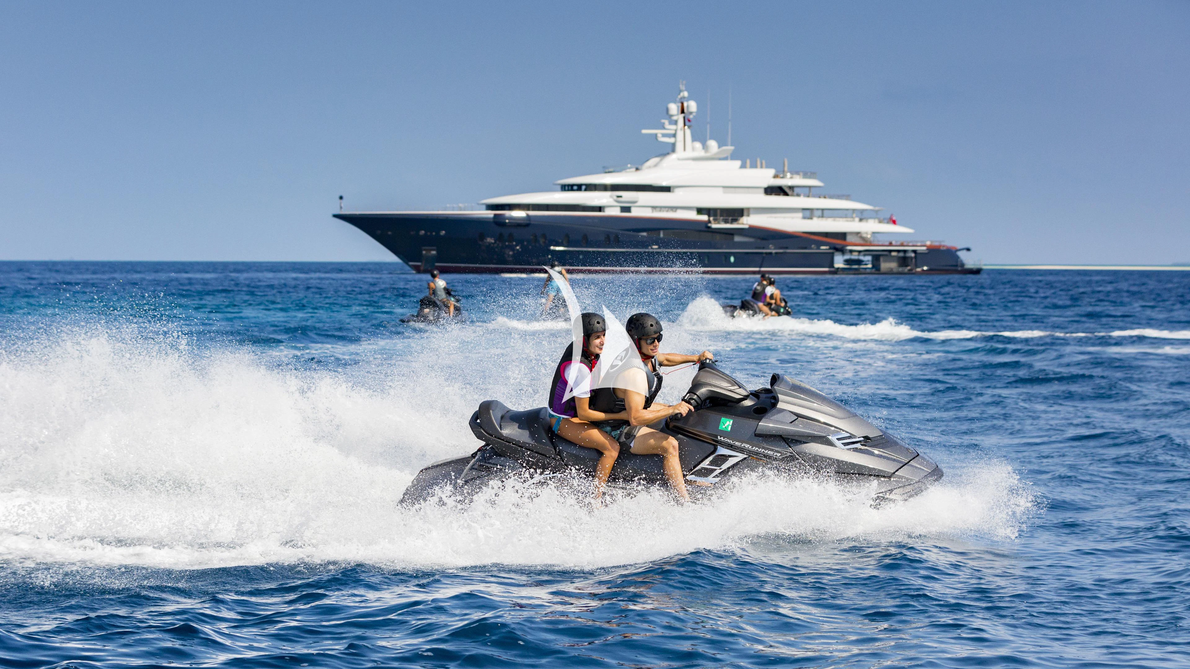 a group of people on a jet ski in the water aboard NIRVANA Yacht for Sale