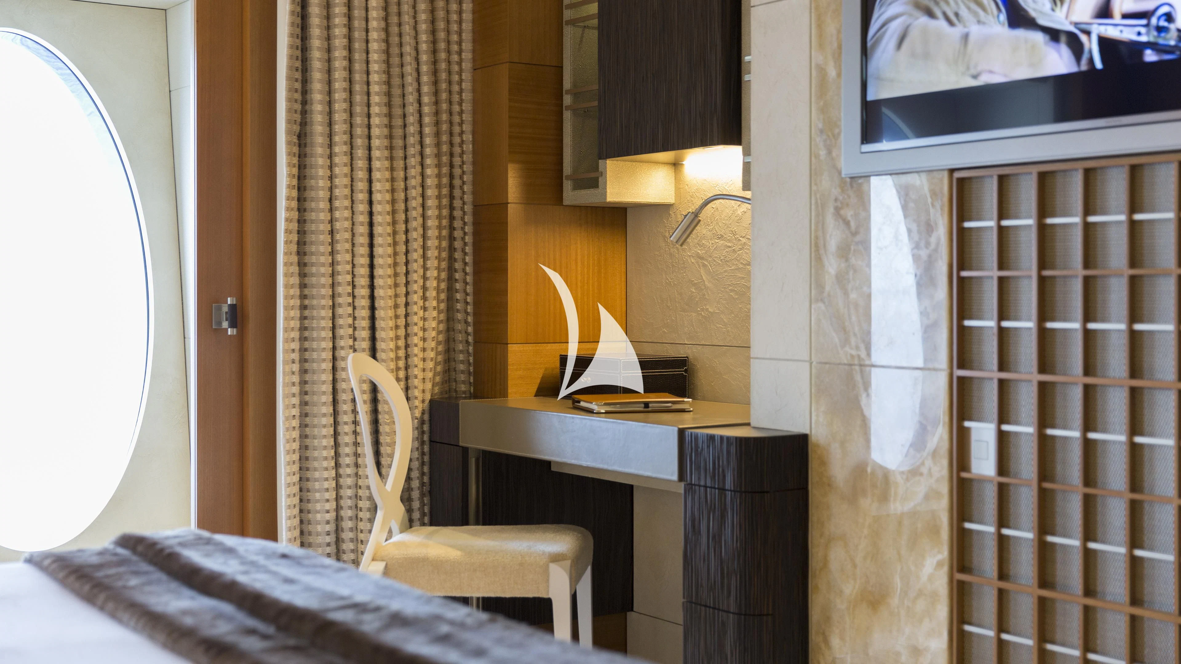 a room with a desk and a window aboard NIRVANA Yacht for Sale